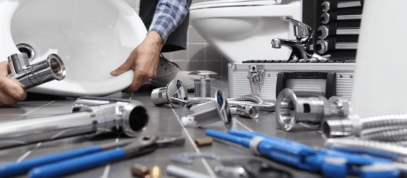 plumber fixing a sink