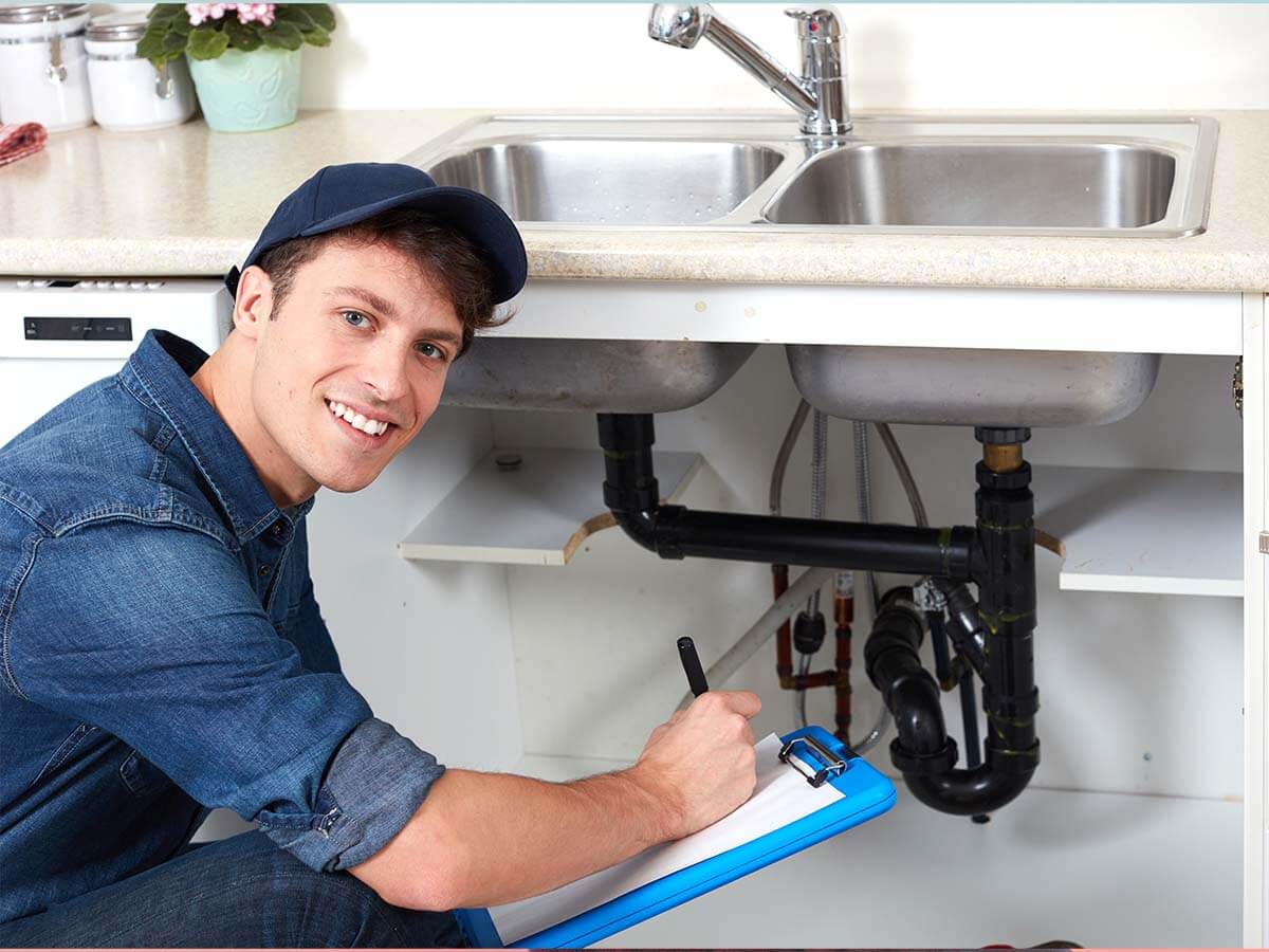 An image of a plumber smiling.