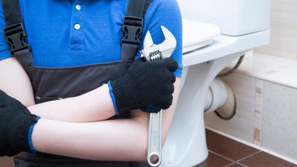 Plumber holding a wrench