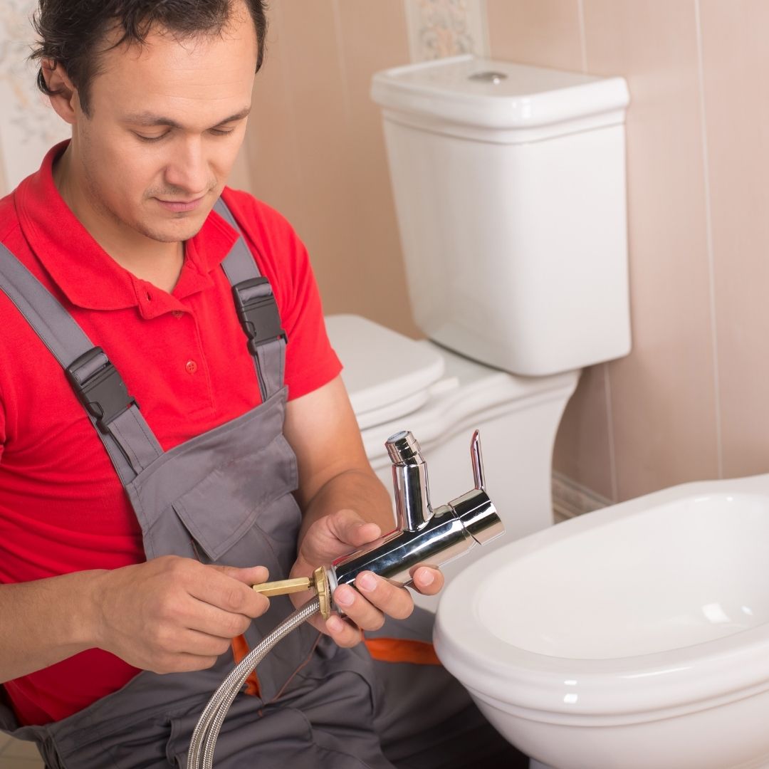 Image-4-62851e6d8fbd9 plumber working on a sink