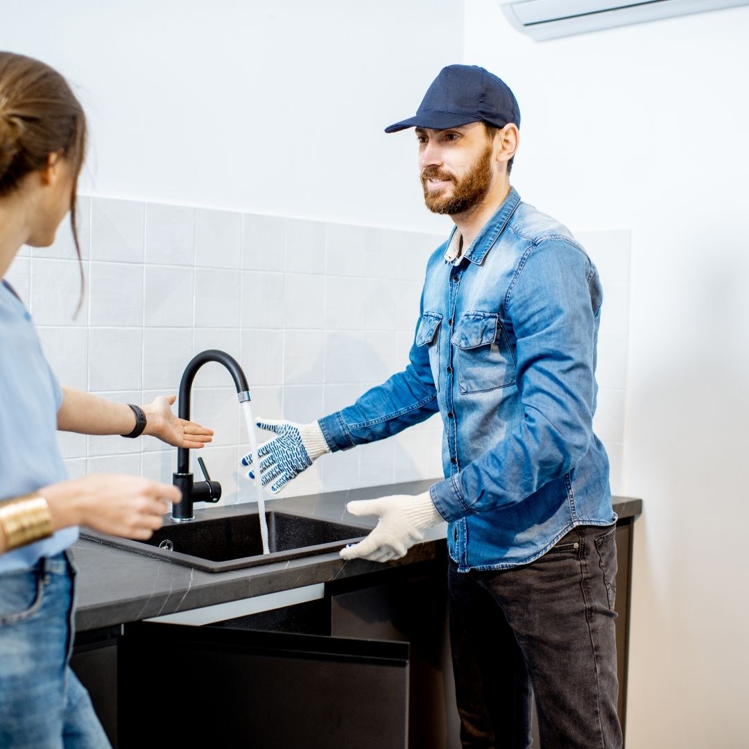 plumber speaking to client