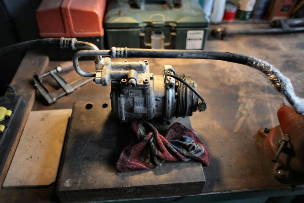 an ac compressor on a workbench