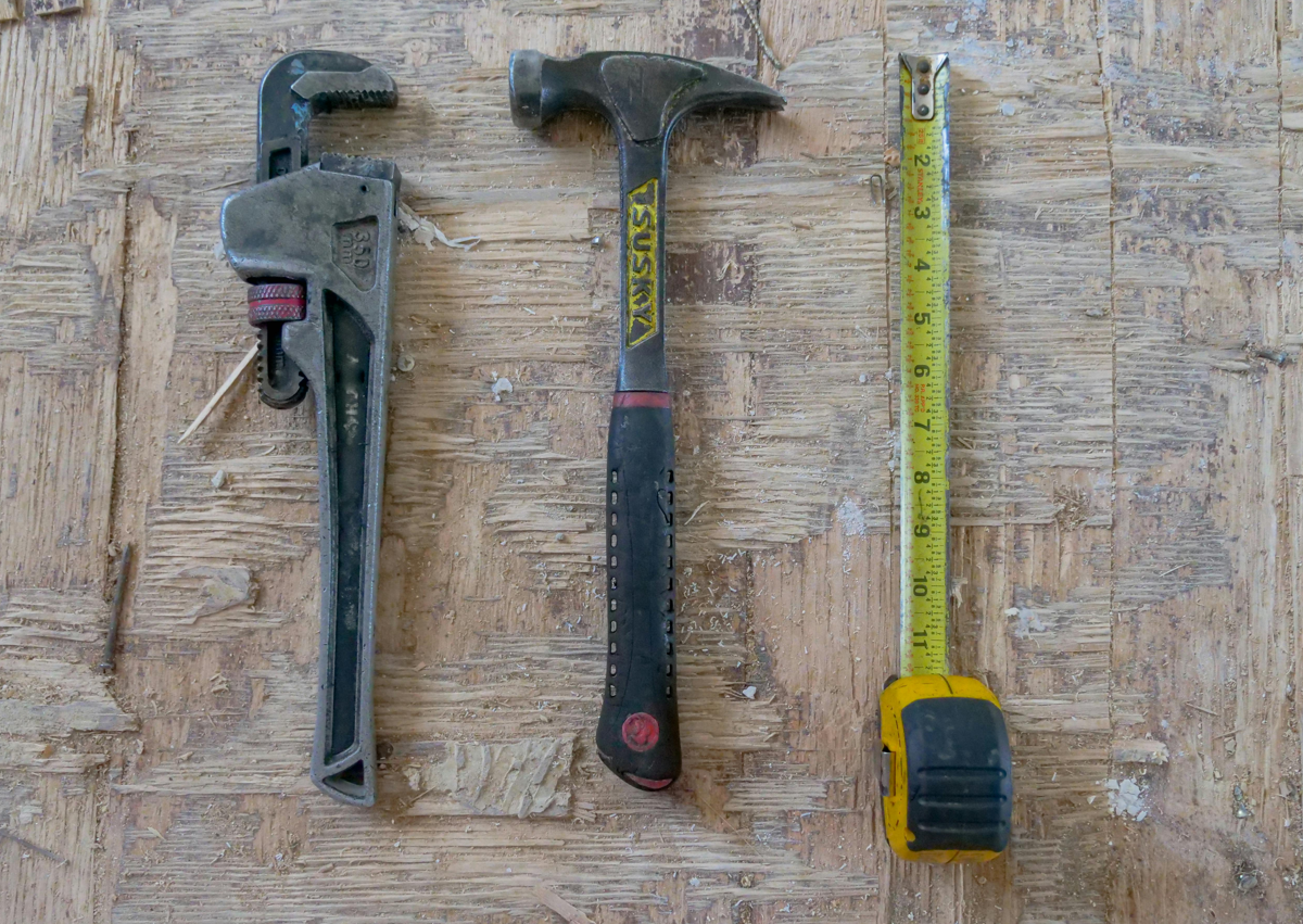 what tools do you need for garbage disposal a hammer, a plumbers wrench, and a tape measure